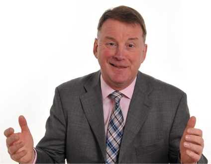 Willie Allan smiling in a suit